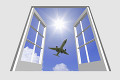 窓から旅客機と入道雲と光