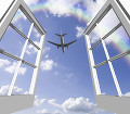 窓から旅客機と雲と虹
