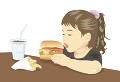 ハンバーガーを食べる子供