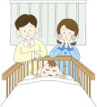 ベビーベッドで眠る赤ちゃんと見守る両親