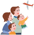 空港から飛行機を見る家族