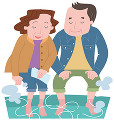 足湯で暖まる中高年夫婦