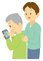 携帯電話の使い方を教わる老人男性