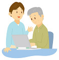 ノートパソコンの使い方を教わる老人男性