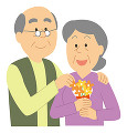 敬老の日で花束を貰う老人女性と老人男性