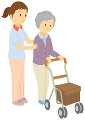 シルバーカーを押して歩く老人女性と介護士