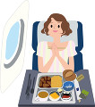 機内食を食べる若い女性